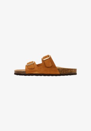 Brown suede slide sandal with two adjustable buckled straps and cork footbed, flat black textured sole.