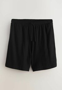 Shorts en éponge noire avec taille élastique et cordon de serrage, longueur mi-cuisse, présentés sur un fond clair uni.