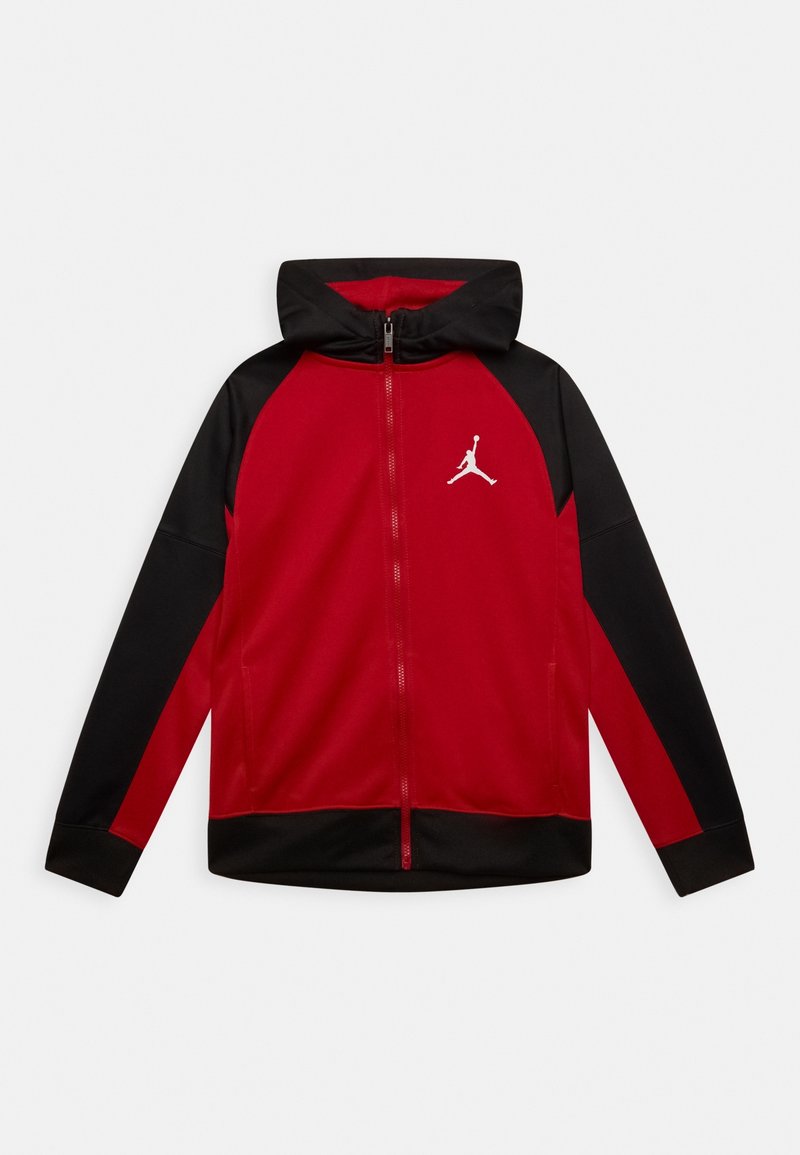 Red and black zip-up hoodie with a hood, featuring raglan sleeves and a white Jumpman logo on the chest. Smooth fabric texture.