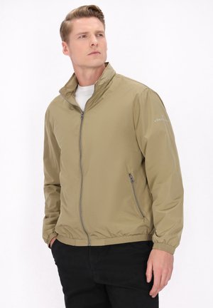 Lichte, khaki ritsjas met een staande kraag, elastische manchetten en zijzakken; glad, waterafstotend materiaal.