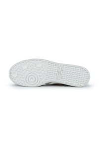 Suela de zapatilla blanca con patrón de agarre texturizado, elementos de dibujo circulares y ovalados, con la marca "HUNGRY" estampada en el lateral.