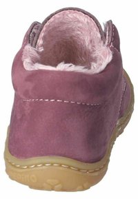 Purple suede ankle boot with a soft pink faux fur lining. The sole is light brown with a textured grip. Features visible stitching.