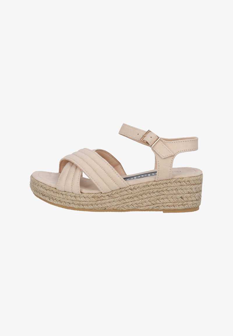 Beige wedge sandals with a braided jute platform, crisscross straps, and an adjustable ankle strap. Soft texture with a smooth finish.
