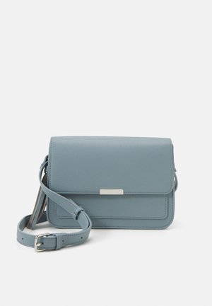 Light blue faux leather crossbody bag with a flap closure, a silver-tone hardware accent, and an adjustable strap. Smooth texture.