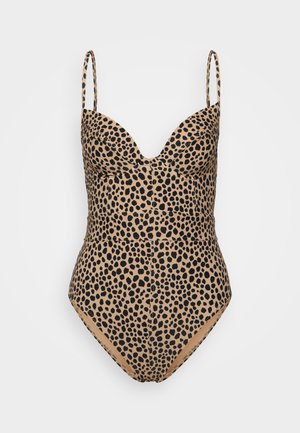 Maillot de bain une pièce à imprimé léopard avec un décolleté plongeant, des bretelles spaghetti et des jambes très échancrées dans des couleurs beige et noir. Texture lisse.