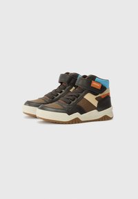 High-top sneakers with a mix of brown, tan, and blue materials. Features a Velcro strap, textured panels, and a rubber sole with grip patterns.