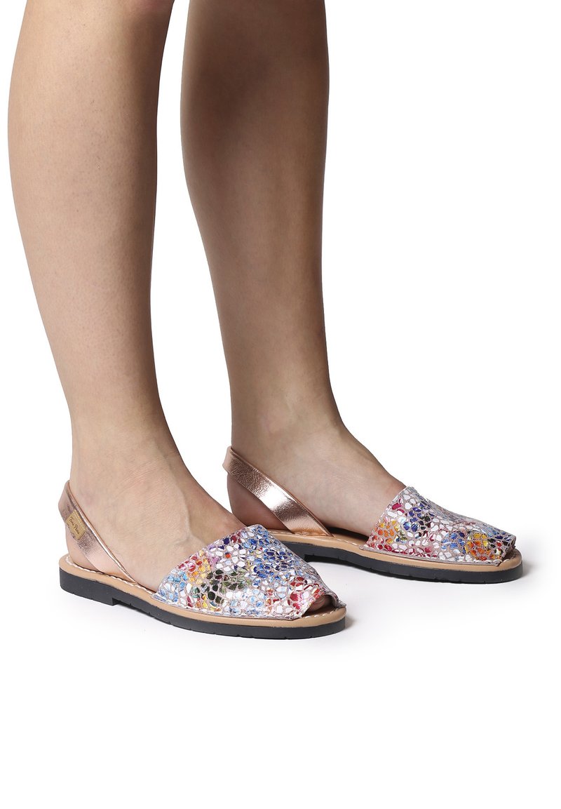 Colorful slingback sandals feature a mesh patterned upper with multicolored details and a metallic rose gold strap and sole. Black rubber outsole.