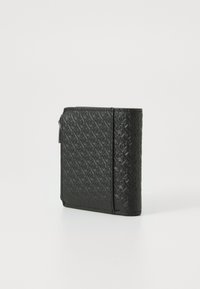 Black leather wallet featuring embossed pattern, rectangular shape, and a zip closure. Textured surface with subtle detailing on the edges.