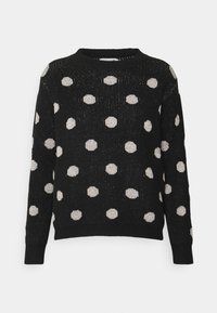 Svart tröja med metallisk silverfärgade prickar. Stickad textur, rundad halsringning och ribbade mudd och nederkant. Avslappnad design.