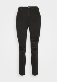 Jeans skinny negros de cintura alta, con desgastes rasgados en las rodillas y una textura suave hecha de material de mezclilla.