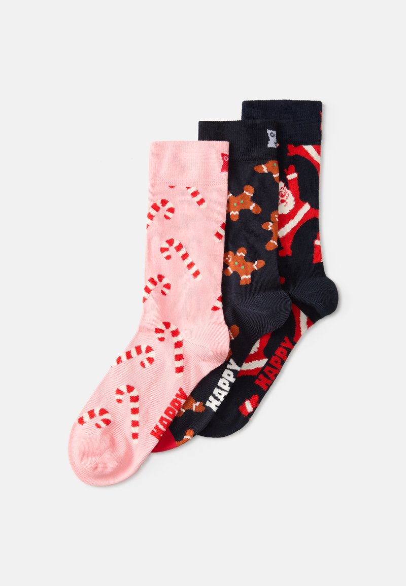 Kolme paari puuvillaseid sokke: roosa, millel on kommikepid, tume sinine inglisepiparkoogimeestega ja tume sinine jõuluvana, millel on kontrastsed valged ja punased aktsendid.