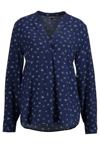 Blusa a maniche lunghe blu navy realizzata in tessuto leggero, con patta frontale con bottoni e motivo floreale bianco su tutta la superficie.
