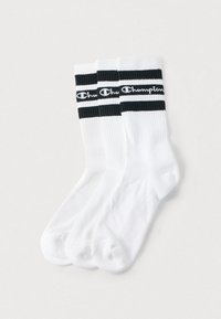 Λευκές κάλτσες πλήρους μήκους με μαύρες και λευκές οριζόντιες ρίγες στο πάνω μέρος και τυπωμένο λογότυπο. Κατασκευασμένες από μαλακό, υφασμάτινο μείγμα βαμβακιού.