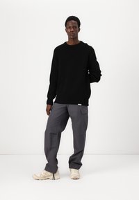 Cleptomanicx Neule - black