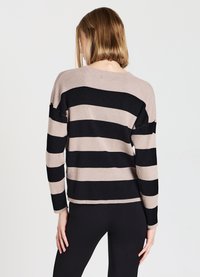 Striped sweater in ribbed fabric; features horizontal beige and black stripes, crew neckline, and long sleeves, with a relaxed fit.