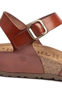 Brown leather sandal with a buckle strap, cork footbed, and textured rubber sole. Features embossed logo and stitched details.
