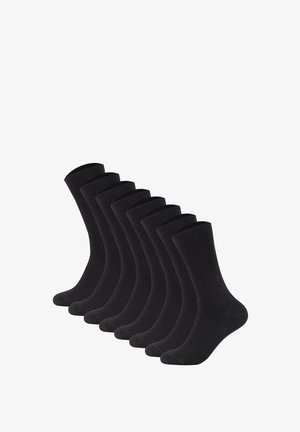 Sæt bestående af otte sorte sokker lavet af et blødt stof, med en ribbet manchet og glat tekstur. Standard længde i crew-design.