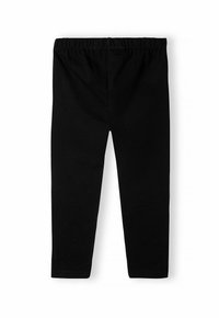 Leggings noirs en coton avec une taille élastique, présentant une texture lisse et un design ajusté. Pas de motifs ou d'accents visibles.
