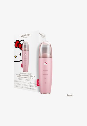 Gommage pour la peau à microcourant rose de marque Hello Kitty avec un capuchon transparent à côté de sa boîte blanche avec le visage de Hello Kitty et les détails du produit.
