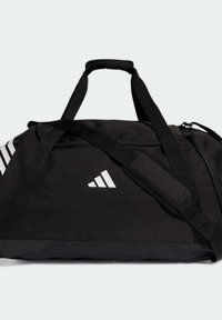 Bolsa de lona negra hecha de tela duradera, con diseño de tres rayas blancas y logo, asa acolchada y correa de hombro ajustable.