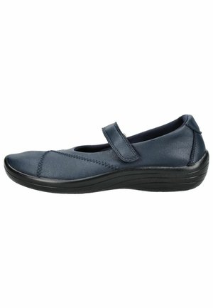 Women’s navy blue Mary Jane shoe with adjustable strap and low black cushioned sole, shown from right side profile.