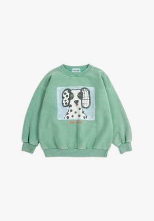 Green children's sweatshirt with a graphic of a spotted dog with mismatched ears and "Bobo Choses" text below.