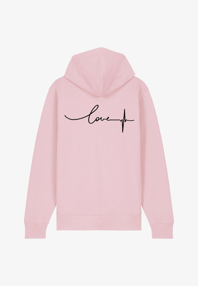Haut à capuche rose avec cordon de serrage. Présente un texte "amour" en cursive noire et un motif de ligne de battement de cœur au dos. Texture douce.