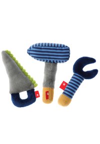 Three plush toys shaped like tools: a gray saw with green accents, a striped hammer in blue and gray, and a blue wrench with plush texture.