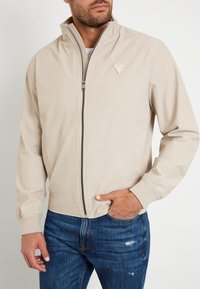 Guess Lengva striukė - beige