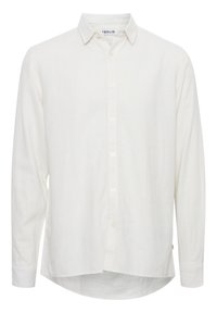 Chemise blanche à manches longues en tissu léger. Présente un col classique, des boutons sur le devant et un ourlet arrondi. Texture lisse.
