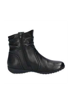 Bottine noire en cuir avec fermeture éclair latérale, semelle compensée basse et tige légèrement froncée, vue de l'extérieur.