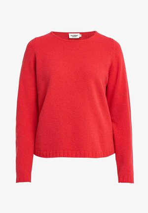 Punainen villapaita, joka on valmistettu pehmeästä kankaasta ja jossa on pitkät hihat ja pyöreä kaula-aukko. Paitassa on ribbaushelma ja hihansuut, jotka tarjoavat turvallisen istuvuuden. Yksinkertainen, tasainen värisuunnittelu.