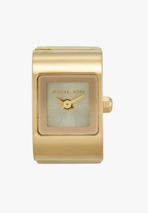 Relógio de pulso em tom de ouro com caixa retangular, mostrador verde texturizado e ponteiros dourados. Apresenta o nome da marca "MICHAEL KORS" no mostrador.