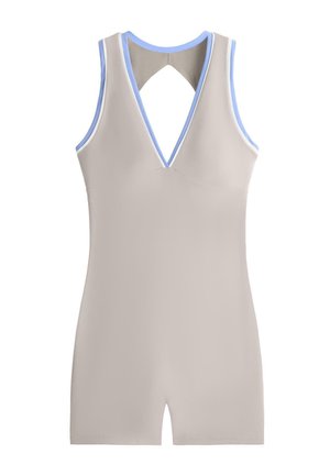 Ujjatlan bézs overál mély V-nyakkivágással, világoskék szegéllyel a kar- és nyakkivágások körül, valamint egy kis kulcslyuk alakú kivágással a háton.