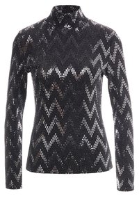 Svart polotröja med ett zigzag-mönster av glittrande paljetter, med långa ärmar och en åtsittande siluett.