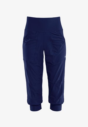 Navy athletic capri pants with a wide waistband, side ruching details, and fitted cuffs. Made of lightweight, stretchy fabric.