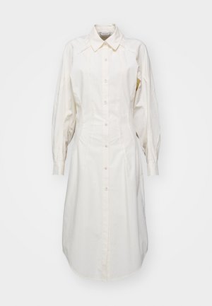 Cremefarbenes, langärmeliges Hemdkleid aus Baumwolle. Verfügt über eine Knopfleiste, einen spitzen Kragen und dezente Panelelemente.