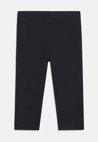 Schwarze, gerippte Leggings mit taillierter Passform, ausgestattet mit einem elastischen Bund und glatter Textur, konzipiert für Komfort und Flexibilität.