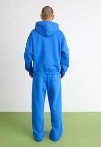 Jordan JORDAN BROOKLYN FLEECE - Treniņtērpa apakšdaļas - sport blue/white