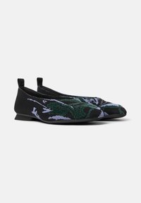 Black flats with a textured design featuring green and lavender patterns, showcasing a sleek silhouette and subtle heel.