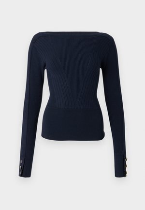 Marineblauwe geribbelde trui met lange mouwen, voorzien van een aansluitend model en drie knoopaccenten op elke manchetten. Gestructureerde gebreide stof.