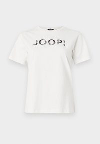 Λευκό βαμβακερό t-shirt με μαύρο γραφικό σχέδιο της λέξης «JOOP!» στο μπροστινό μέρος. Λαιμόκοψη τύπου crew και κοντά μανίκια.