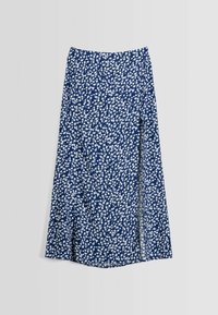 Marinblå kjol med vitt blommönster, A-linjeformad design, sidoklyvning och flödande lätt tyg. Halvlång med elastisk midja.