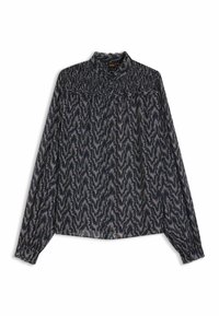 Blusa a maniche lunghe in tessuto leggero con un motivo a zigzag blu scuro e scollatura arricciata. Presenta chiusura con bottoni e polsini arricciati.