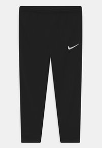 Pantalones deportivos negros de tejido ligero, con un logo plateado de Nike en el muslo superior y cinturilla y puños elásticos.