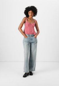 Tommy Jeans CHARLIE BELT - Wide leg - mid light blue