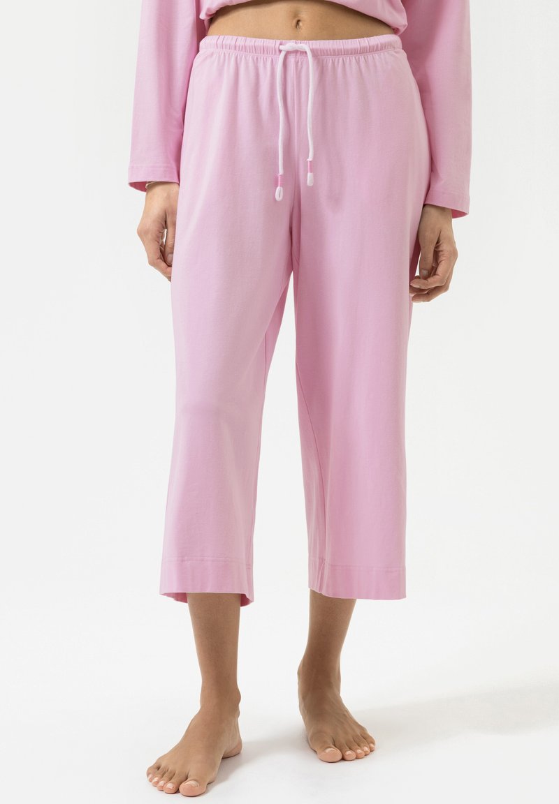 Roze cropped broek gemaakt van zachte stof, met een elastische tailleband met trekkoord en een ontspannen pasvorm die net boven de enkel eindigt.