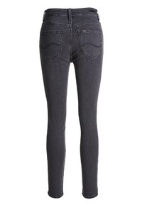 Czarne skinny jeans wykonane z denimu, z wysokim stanem, podwójnymi tylnymi kieszeniami z wygiętymi szwami oraz slim fit przez nogawki.