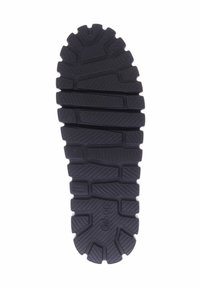 Black rubber shoe sole featuring a tread pattern with grooves and ridges for grip, marked with "Gabor" and "Made in Slovakia."