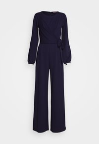 Marinblå omlott jumpsuit med långa ärmar, knytbälte i midjan och vida, flödande ben. Tillverkad av ett slätt, texturerat tyg.